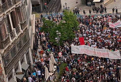 Activists protest near the Spanish Parliament following the eviction of 87-year-old Maricarmen to demand stronger laws to protect renters in Madrid, Spain, Friday, Oct. 2, 2026. 
