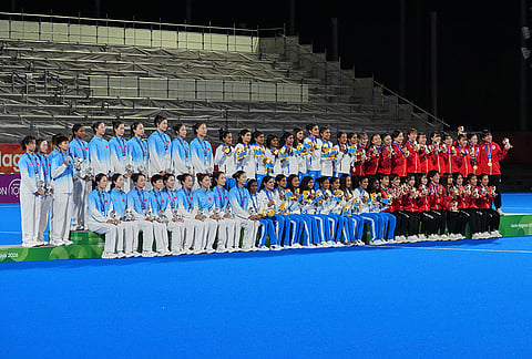 Gold medalists India, centre, silver medalists China, left, and bronze medalists Japan, right, pose on the podium during the medal ceremony after the women's hockey finals at the Asian Games in Gifu, Japan, Friday, Oct. 2, 2026. 