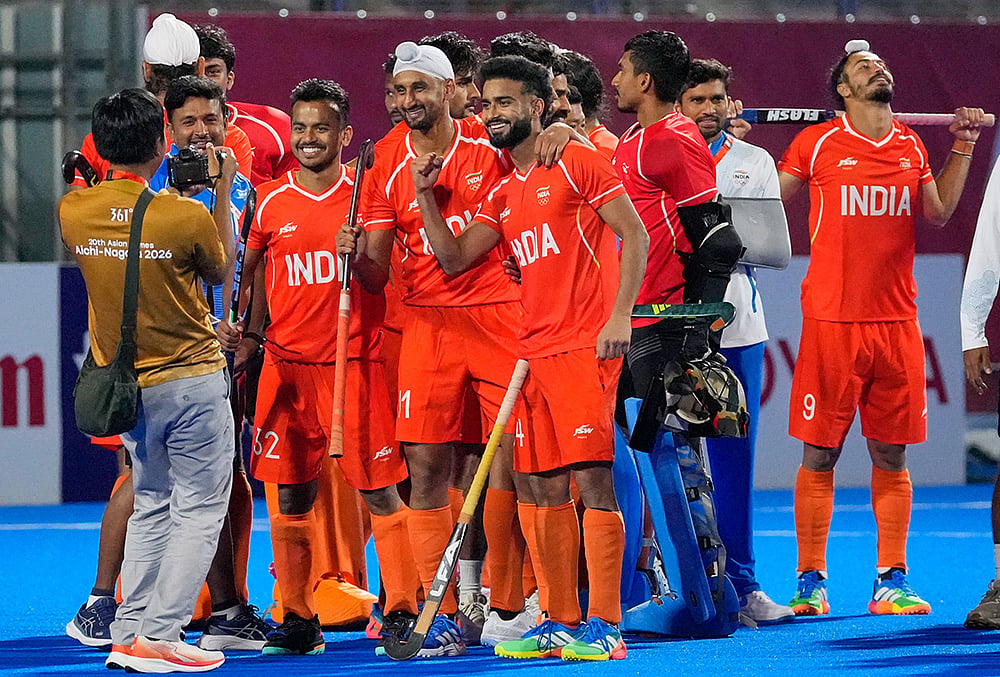 Team India celebrate their gold medal after the men's hockey final match against Malaysia at the Asian Games in Gifu, Japan, Saturday, Oct. 3, 2026.  - | Photo: AP/Dita Alangkara
