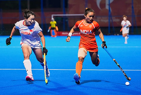 India's Lalremsiami and China's Ou Zixia compete for the ball during the women's hockey gold medal match at the Asian Games in Gifu, Japan, Friday, Oct. 2, 2026. 