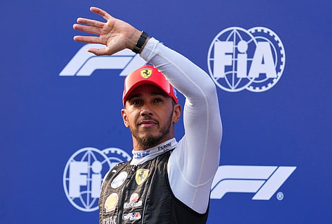 Ferrari driver Lewis Hamilton of Britain waves to spectators after the qualifying session at the Bahrain Grand Prix in Sepang, Malaysia, Saturday, Oct. 3, 2026. 