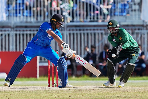 India's Abhishek Sharma, left, hits a shot during the gold medal cricket match between India and Pakistan at the Asian Games in Nagoya, Japan, Saturday, Oct. 3, 2026. 