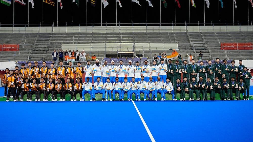 From left, players from silver medalist Malaysia, gold medalist India and bronze medalist Pakistan pose during the men's hockey medal ceremony at the Asian Games in Gifu, Japan, Saturday, Oct. 3, 2026. - | Photo: AP/Dita Alangkara