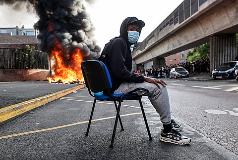 Students burn garbage as they protest to demand more resources for school, in Lille, France, Thursday, Oct. 1, 2026. 
