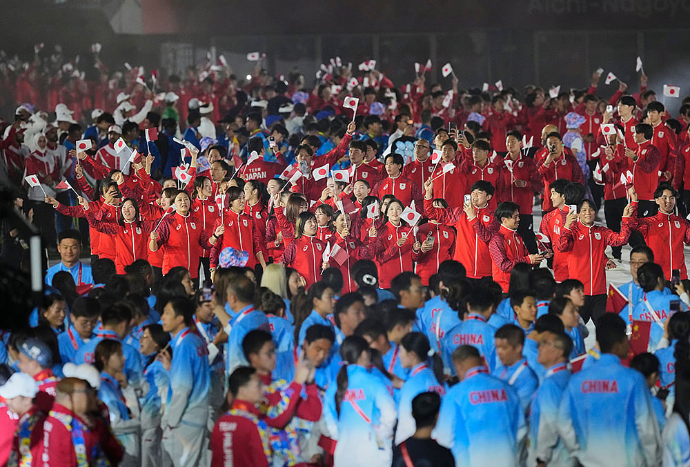 Japanese athletes look on during the closing ceremony