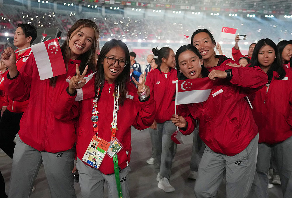 Singapore athletes look on during the closing ceremony