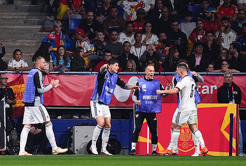 Czechia's Jiri Slama celebrates with teammates after scoring his sides first goal during the UEFA Nations League soccer match between Spain and Czechia in Oviedo, Spain, Saturday, Oct. 3, 2026. 