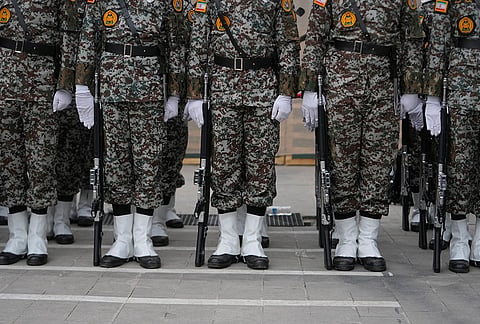 Iranian army cadets stand during the opening ceremony of one of the military training centers for volunteers being set up throughout squares in downtown Tehran, Iran, Saturday, Oct. 3, 2026. 
