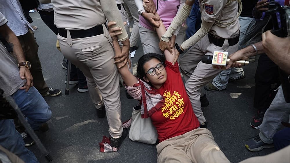 All India Students' Association (AISA) National President Neha Bora being detained during a protest carried out by political parties and members of AISA, SFI, NSUI and other student bodies against Chief Election Commissioner (CEC) Gyanesh Kumar, demanding his resignation over the alleged irregularities in the Special Intensive Revision (SIR) of electoral rolls and mass deletion of voters, at Jantar Mantar, in New Delhi, Friday, Oct. 2, 2026. - File Photo| Photo: Suresh K Pandey/Outlook