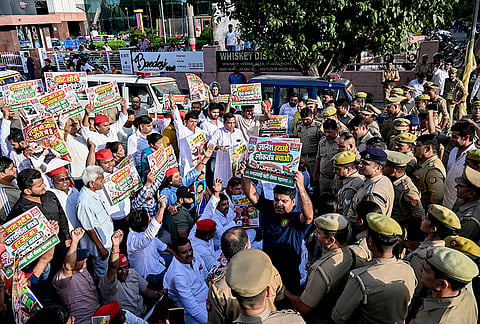 Samajwadi Party workers during a protest against Chief Election Commissioner (CEC) Gyanesh Kumar, in Noida, Gautam Buddha Nagar district, Uttar Pradesh.