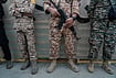 | Photo: AP/Vahid Salemi : Men affiliated with the Revolutionary Guard stand during the opening ceremony of one of the military training centers for volunteers being set up throughout squares in downtown Tehran, Iran, Saturday, Oct. 3, 2026. 
