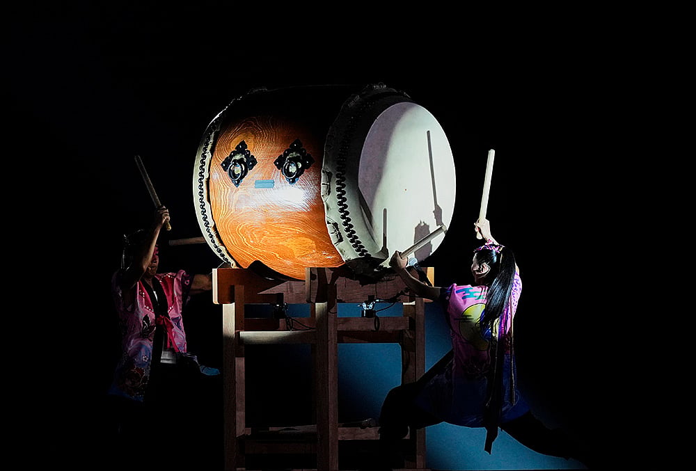 Drummers perform during the closing ceremony for the Asian Games 
