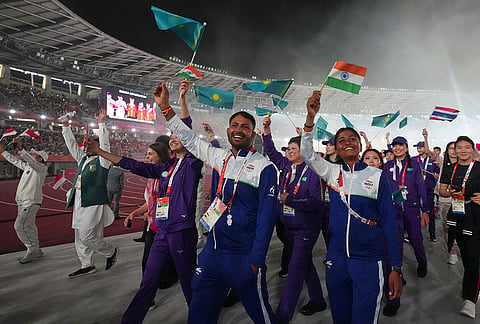 Athletes from India walk with fellow athletes as they leave the arena following the closing ceremony for the Asian Games in Nagoya, Japan, Sunday, Oct. 4, 2026.