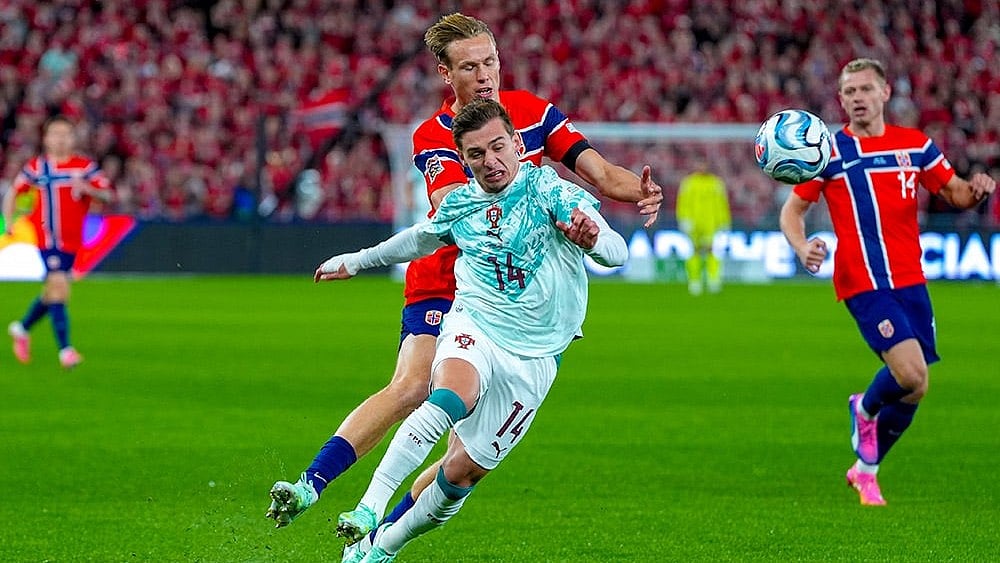 Norway's Torbjørn Lysaker Heggem, left, and Portugal's Francisco Conceicão vie for the ball during a Nations League soccer match between between Norway and Portugal, in Oslo, Sunday, Sept. 27, 2026. - | Photo: Lise Åserud/NTB Scanpix via AP