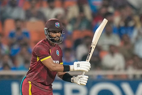 West Indies' Shai Hope celebrates his century during the third and final One Day International (ODI) cricket match of a series between India and West Indies, in Mullanpur, Saturday, Oct. 3, 2026. 
