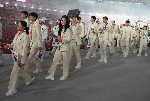 South Korean athletes react during the closing ceremony for the Asian Games in Nagoya, Japan, Sunday, Oct. 4, 2026. 
