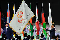 Asiad 2026 Closing Ceremony: Games Officially Declared Closed In Aichi-Nagoya By OCA President Sheikh Joaan | Photo: AP/Dita Alangkara : President of the Olympic Council of Asia, Sheikh Joaan Bin Hamad Al Thani, left, looks at the Olympic Council of Asia flag as the as Sheikh Mohammed bin Abdulrahman Al Thani, Prime Minister of Qatar holds it during the closing ceremony for the Asian Games in Nagoya, Japan, Sunday, Oct. 4, 2026.