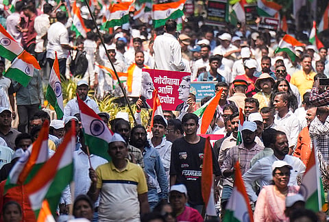 Shiv Sena (UBT) and NCP (SP) supporters during the 'Virat Garjana Morcha' rally against Chief Election Commissioner (CEC) Gyanesh Kumar over alleged irregularities in the Special Intensive Revision (SIR) of electoral rolls, in Mumbai, Maharashtra.