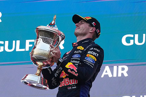 Red Bull driver Max Verstappen of the Netherlands celebrates on the podium after winning the Bahrain Grand Prix in Sepang, Malaysia, Sunday, Oct. 4, 2026.