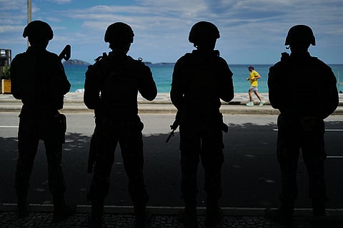 Soldiers guard Leblon beach during general elections in Rio de Janeiro, Brazil, Sunday, Oct. 4, 2026.