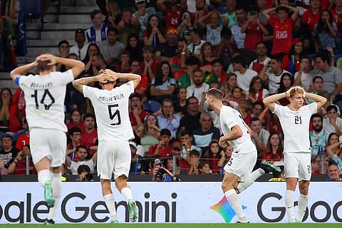 Norway's Kristoffer Ajer, center, celebrates after scoring the opening goal during the Nations League soccer match between Portugal and Norway in Porto, Portugal, Sunday, Oct. 4, 2026.