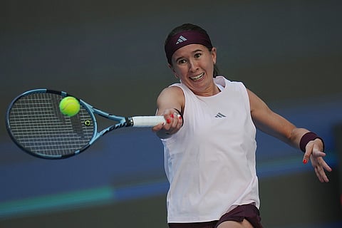 Nikola Bartunkova, of the Czech Republic, returns a ball to Aryna Sabalenka, of Belarus, during the third round of the women's singles match at the China Open tennis tournament in Beijing, Sunday, Oct. 4, 2026.