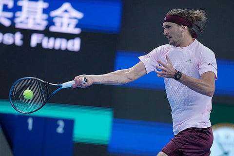 Alexander Zverev, of Germany, returns a ball to Novak Djokovic, of Serbia, during the men's singles quarterfinals match at the China Open tennis tournament in Beijing, Sunday, Oct. 4, 2026.