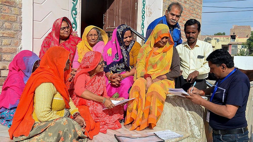 A Booth Level Officer interacts with people about the Special Summary Revision (SSR) of electoral rolls - | Photo: PTI
