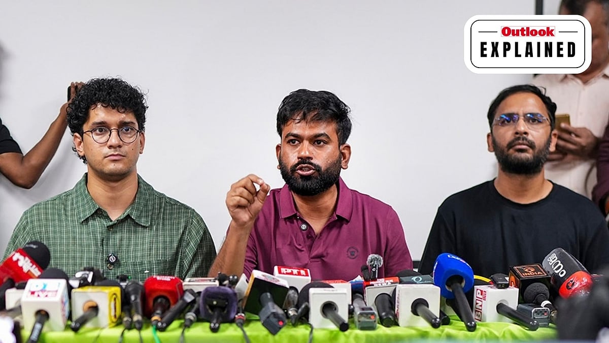 Cockroach Janta Party (CJP) founder Abhijeet Dipke addresses a press conference as Co-conveners Saurav Das, left, and Ashutosh Ranka, right, look on, in New Delhi. - | Photo: PTI/Karma Bhutia