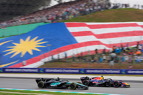 Red Bull driver Max Verstappen of the Netherlands and Mercedes driver Andrea Kimi Antonelli of Italy compete in the Bahrain Grand Prix in Sepang, Malaysia, Sunday, Oct. 4, 2026.