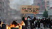 | Photo: AP/Jean-Francois Badias : A students holds a board reading, "we want the BAC (High School Diploma) Not the BAC (Anti-criminality units)" during a protest to demand more resources at school, in Lille, France.
