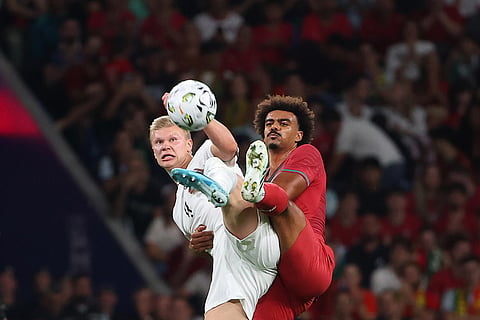 Norway's Erling Haaland vies for the ball with Portugal's Renato Veiga, right, during the Nations League soccer match between Portugal and Norway in Porto, Portugal, Sunday, Oct. 4, 2026.