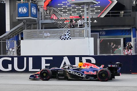 Red Bull driver Max Verstappen of the Netherlands crosses the finish line to win the Bahrain Grand Prix in Sepang, Malaysia, Sunday, Oct. 4, 2026.