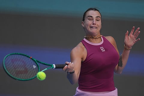 Aryna Sabalenka, of Belarus, returns a ball to Nikola Bartunkova, of the Czech Republic, during the third round of the women's singles match at the China Open tennis tournament in Beijing, Sunday, Oct. 4, 2026.