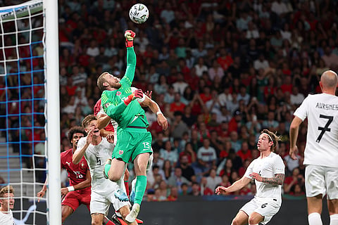 Norway goalkeeper Egil Selvik jumps for the ball during the Nations League soccer match between Portugal and Norway in Porto, Portugal, Sunday, Oct. 4, 2026.