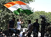 Rahul Gandhi climbed atop a police barrier and waved the Tricolour