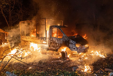 A car burns after a Russian drone strike on a residential neighborhood in Kharkiv, Ukraine, Sunday, Oct. 4, 2026. 
