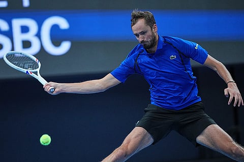 Daniil Medvedev, of Russia, returns a ball to Novak Djokovic, of Serbia, during the men's single semi-final match at the China Open tennis tournament in Beijing, Monday, Oct. 5, 2026.