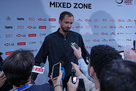 Daniil Medvedev, of Russia, speaks to the media after being disqualified from the men's single semi-final match against Novak Djokovic, of Serbia at the China Open tennis tournament in Beijing, Monday, Oct. 5, 2026.