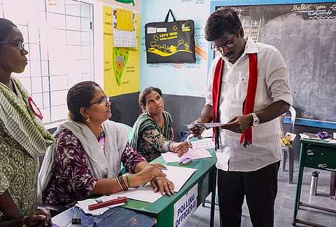 DMK candidate for the Madurantakam constituency, I. Paranthamen, during a visit to a polling station on the day of voting in the Assembly bypolls, at Madurantakam in Chengalpattu district, Tamil Nadu.