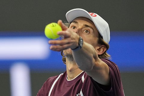 Alex De Minaur, of Australia, prepares serve to Hubert Hurkacz of Poland, during the men's single semi-final match at the China Open tennis tournament in Beijing, Monday, Oct. 5, 2026.
