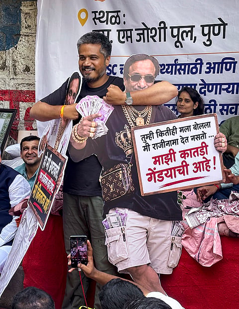NCP (SP) MLA Rohit Pawar during a protest demanding the resignation of the Maharashtra Public Service Commission (MPSC) chairman Vivek Bhimanwar over allegations of exam paper leaks, in Pune.