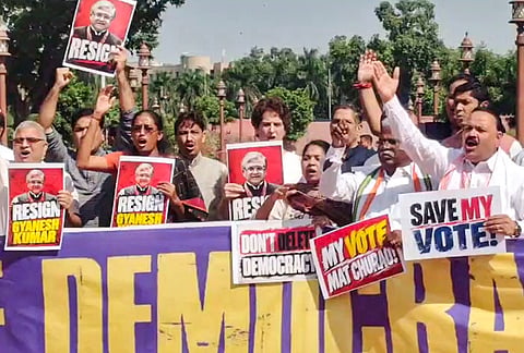 Congress MP Priyanka Gandhi Vadra, MP Imran Masood and other INDIA bloc MPs raise slogans and hold placards demanding the resignation of Chief Election Commissioner Gyanesh Kumar as they march from Parliament towards the Election Commission of India (ECI) office, in New Delhi, Tuesday, Oct. 6, 2026. 
