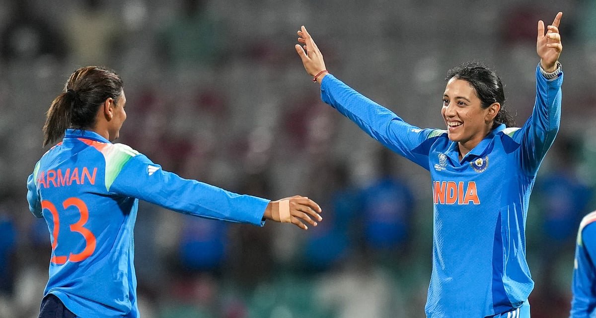 India's captain Harmanpreet Kaur (left) celebrates the wicket of New Zealand's Jess Kerr with teammate Smriti Mandhana (centre) during their ICC Women's World Cup ODI match at the DY Patil Stadium in Navi Mumbai. - PTI