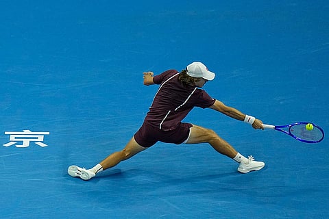 Alex De Minaur, of Australia, returns a ball to Hubert Hurkacz of Poland, during the men's single semi-final match at the China Open tennis tournament in Beijing, Monday, Oct. 5, 2026.