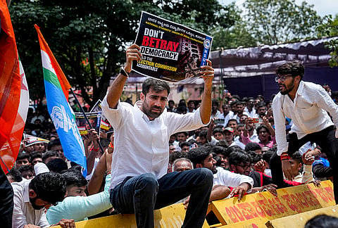 National Students' Union of India (NSUI) National President Vinod Jakhar, alongside members and supporters, holds placards during a protest demanding the resignation of Chief Election Commissioner Gyanesh Kumar at Freedom Park, in Bengaluru, Karnataka.
