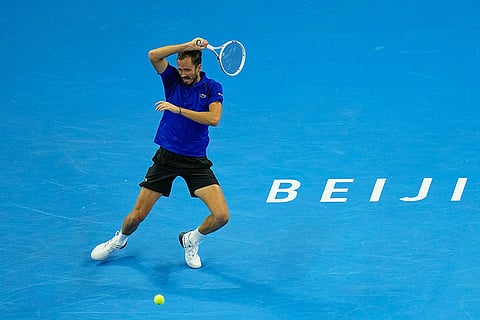 Daniil Medvedev, of Russia, returns a ball to Novak Djokovic, of Serbia, during the men's single semi-final match at the China Open tennis tournament in Beijing, Monday, Oct. 5, 2026.