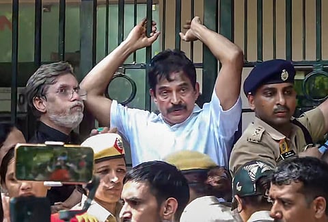 Congress General Secretary KC Venugopal alongside party leader Pawan Khera as security personnel block their path during an INDIA bloc protest march from Parliament towards the Election Commission of India (ECI) office, demanding the resignation of Chief Election Commissioner Gyanesh Kumar, at Akashvani Bhawan gate, in New Delhi.