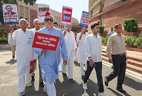 Trinamool Congress (TMC) leaders Derek O'Brien and Abhishek Banerjee along with party MPs march from Parliament towards the Election Commission of India office, holding placards to demand the resignation of Chief Election Commissioner Gyanesh Kumar, in New Delhi. 

