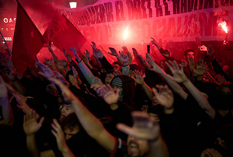 Demonstrators march protesting the housing situation in Spain, just hours after Prime Minister Pedro Sánchez announced an early general election, in Barcelona, Spain, Monday, Oct. 5, 2026. 
